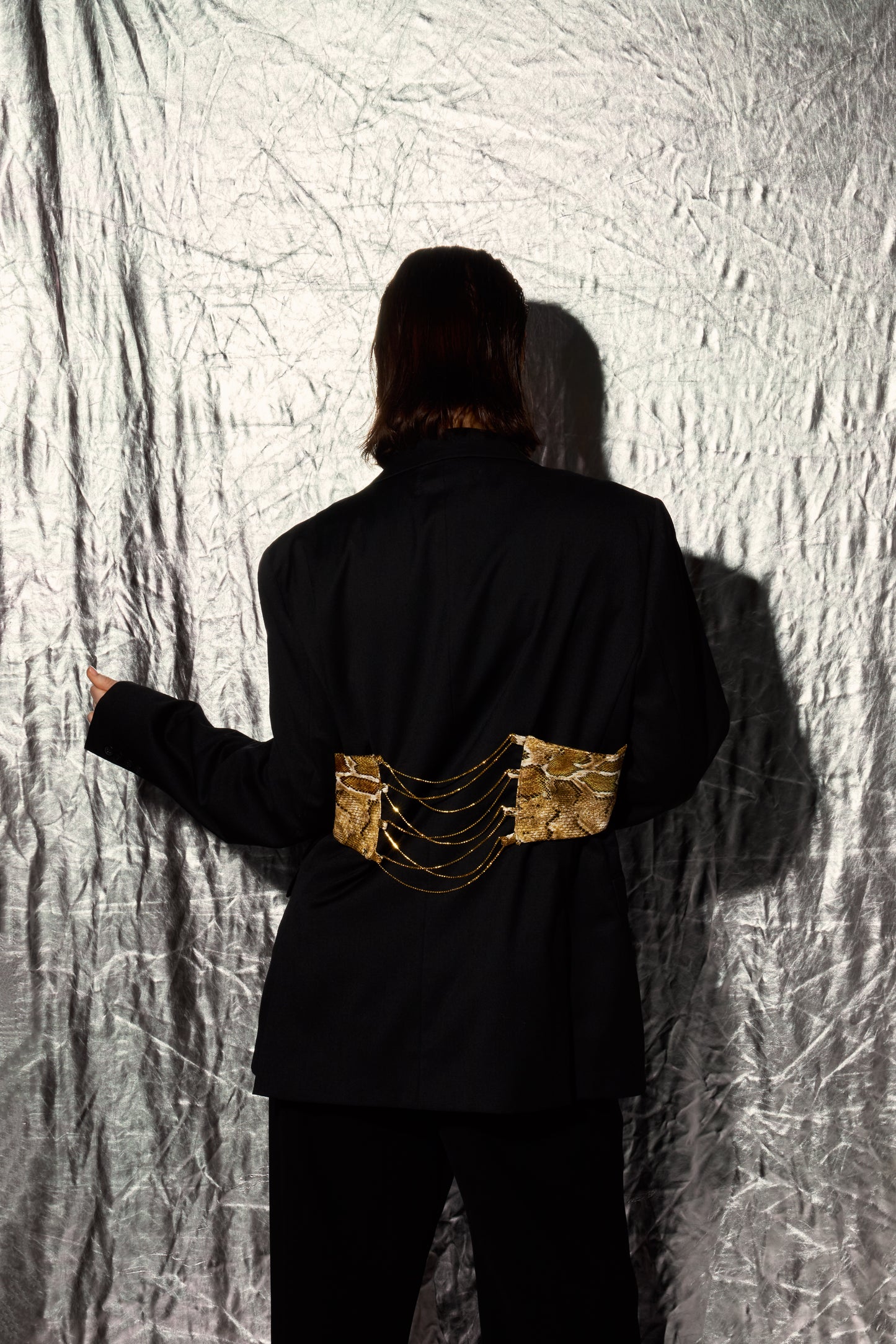 Snake jacket, complemented by gold rhinestone chains