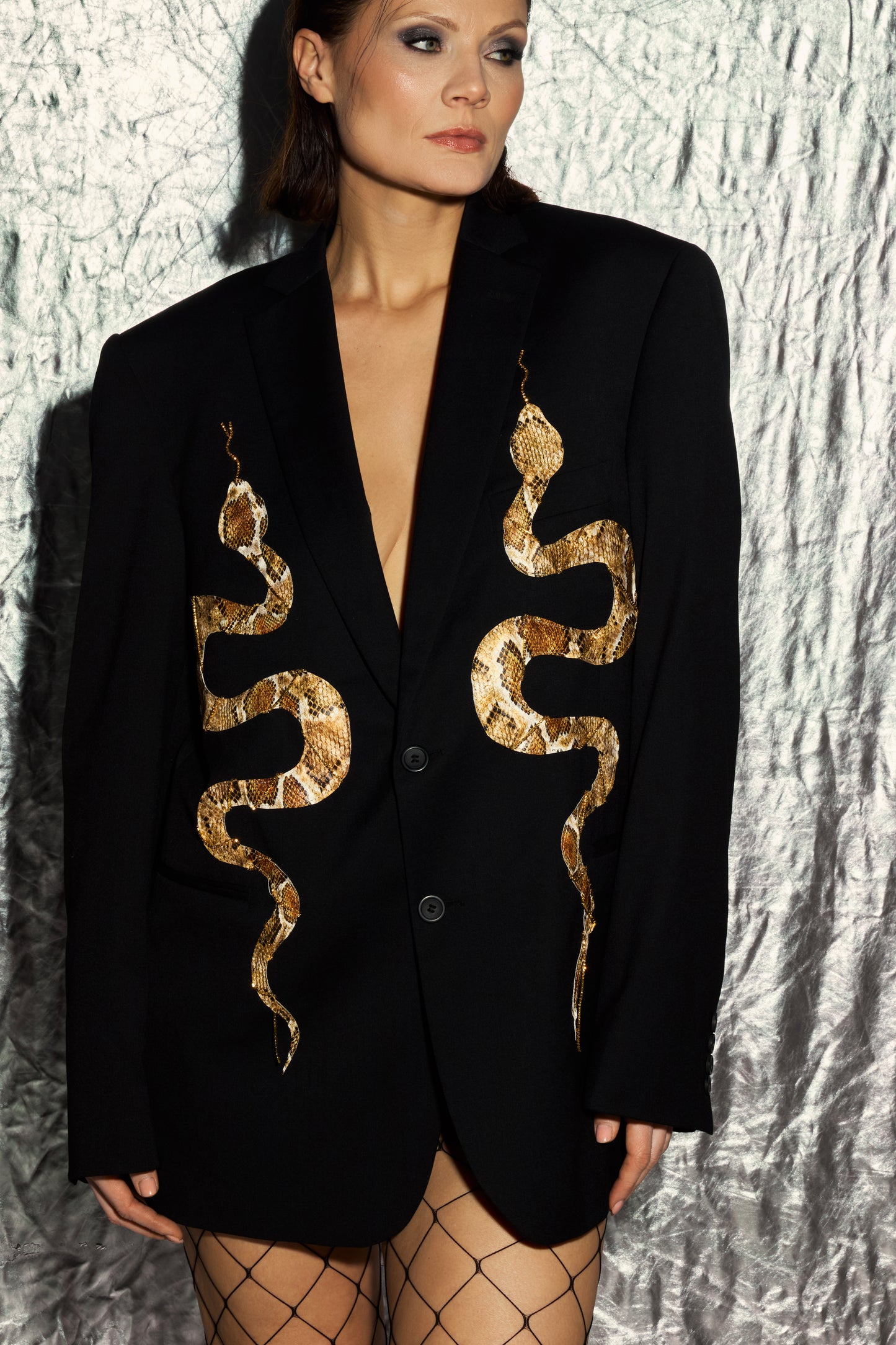 Snake jacket, complemented by gold rhinestone chains